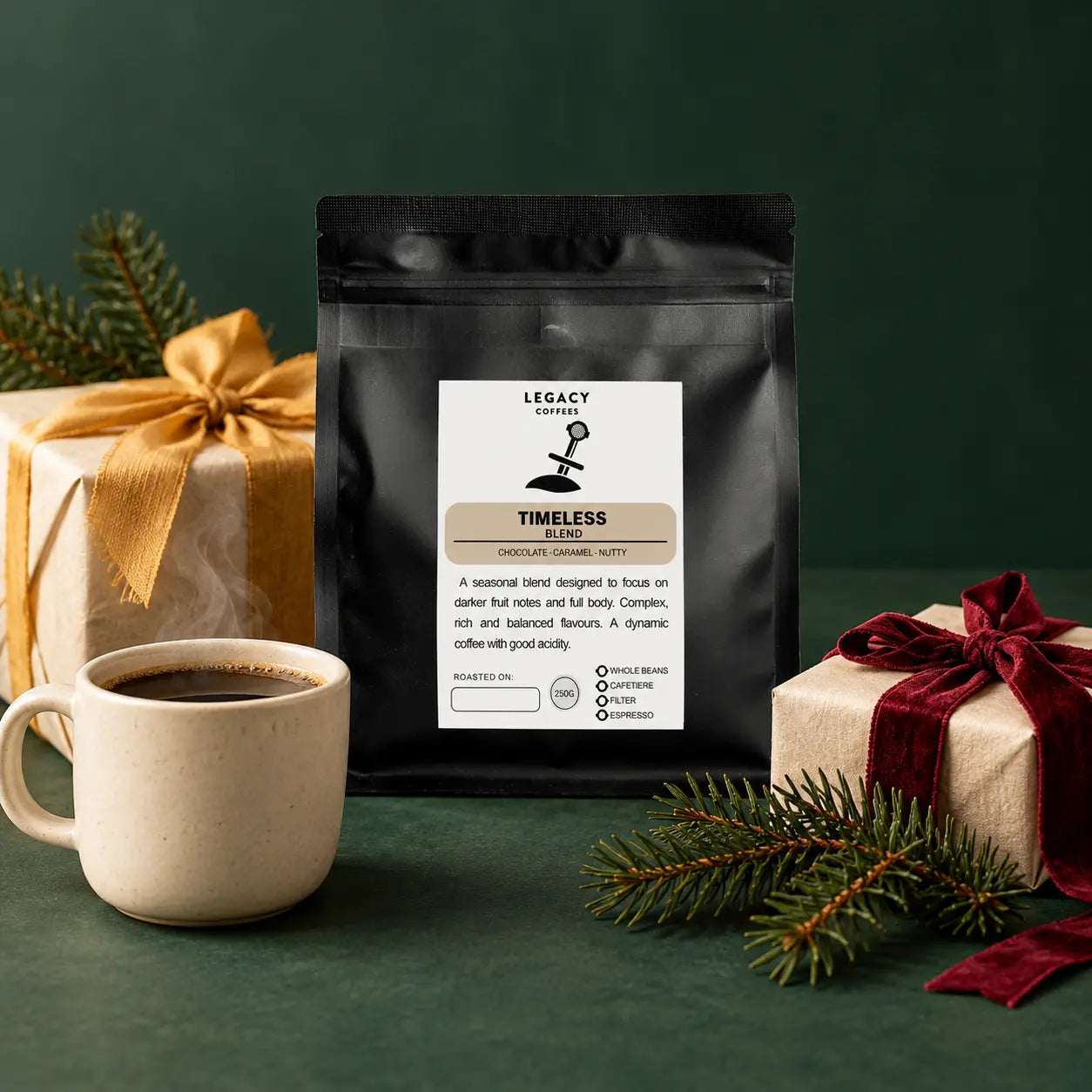 Legacy Timeless coffee with wrapped Christmas gifts, evergreen sprigs and a warm cup of coffee